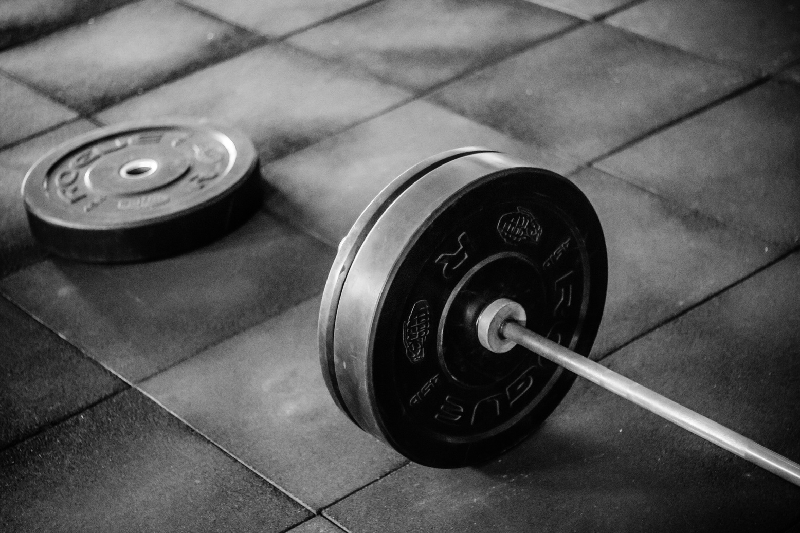 Grayscale Photo of Black Adjustable Barbell